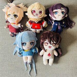 Five chibi-style plush characters from the popular video game Genshin Impact